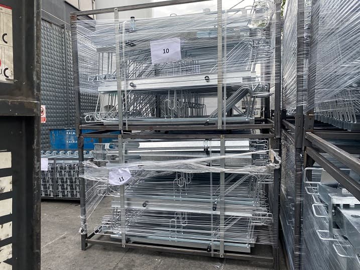 Galvanized steel rack components wrapped in shrink film and ready for shipment