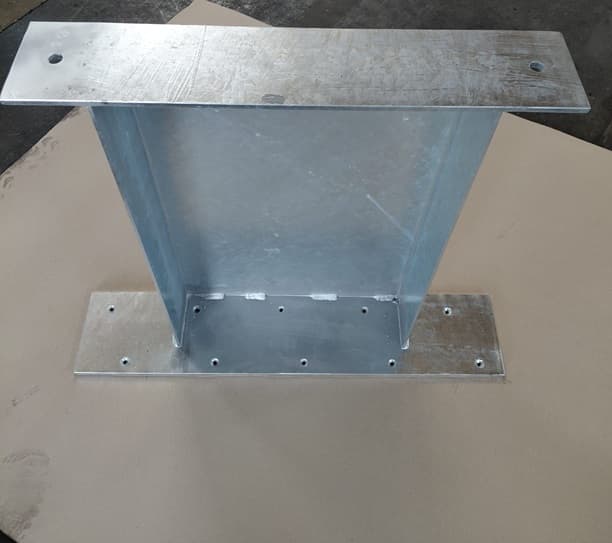 Galvanized steel post with a wide drilled base plate