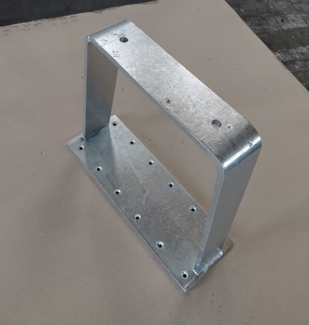 Galvanized steel post base bracket with a drilled mounting plate